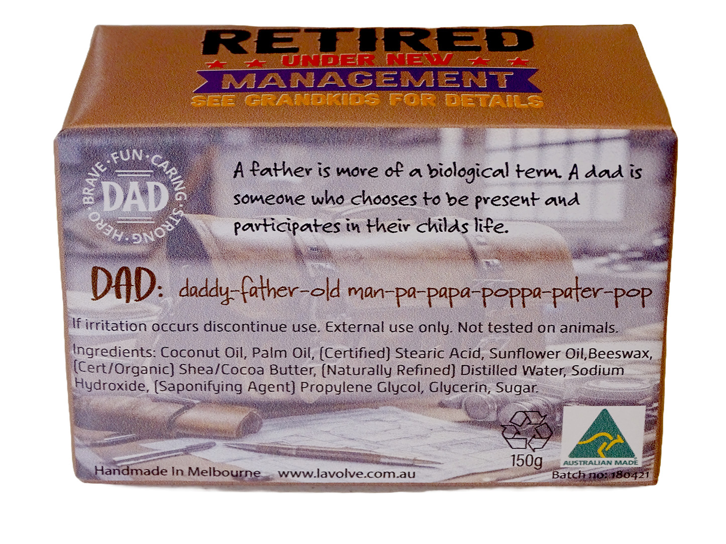 A rectangular cardboard product box for Lavolve 'Retired Under New Management' DAD soap, featuring a brown top and side panels with white and red text, and a faded photo of a father and child on the front.