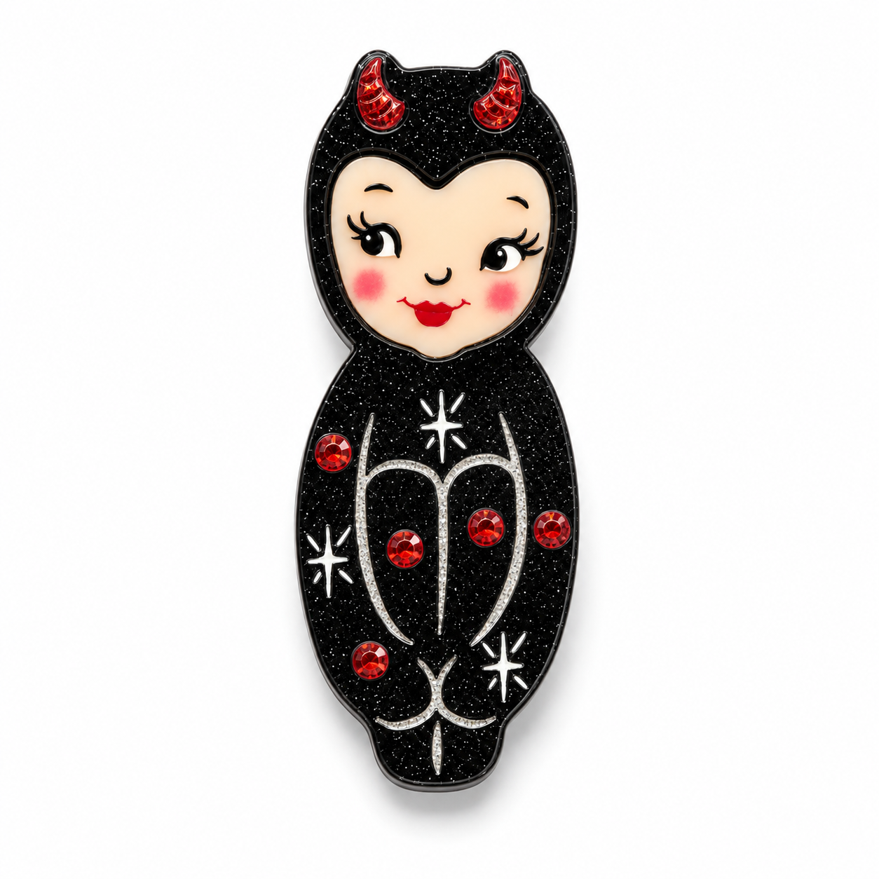 A stylized doll-shaped enamel pin featuring a black glitter body, red devil horns, a cream face, and red rhinestone accents on a white background.