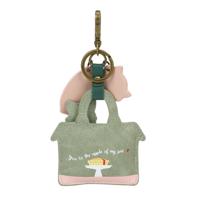 Keychain with a small bag and piggy bank design on a white background