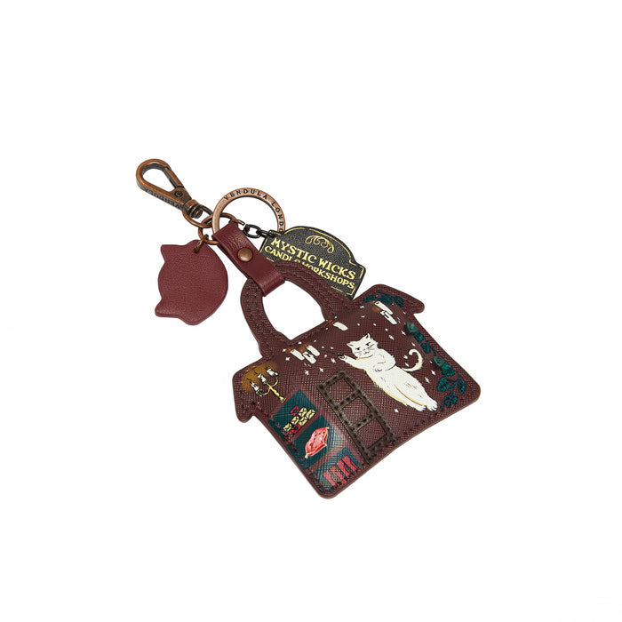Keychain with cat design and 'Mystic Kicks' branding on a white background