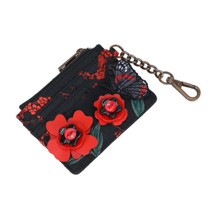 Black pouch with red floral designs and a keychain on a white background