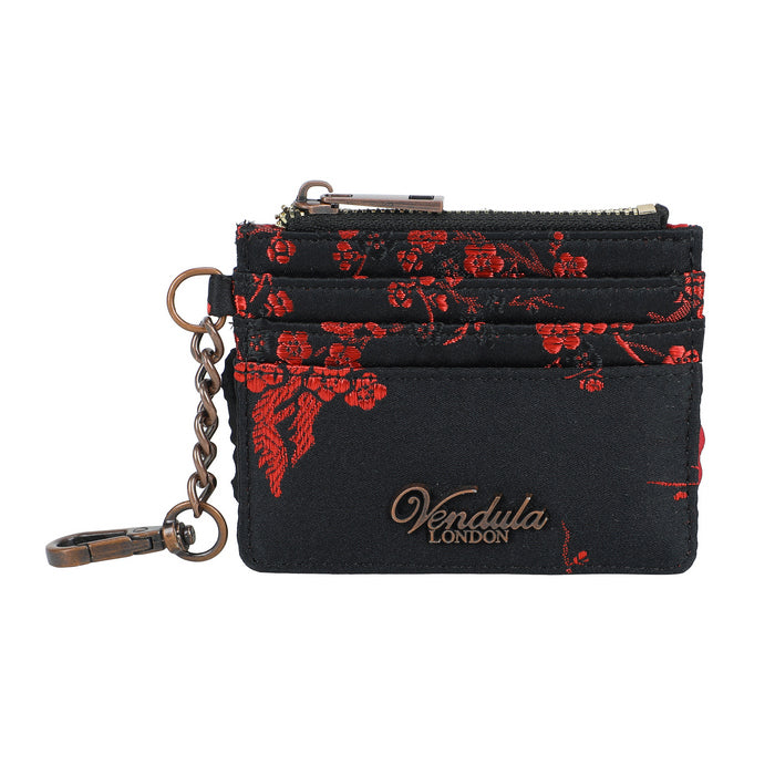 Black cardholder with red floral pattern and 'Vendula London' branding on a white background