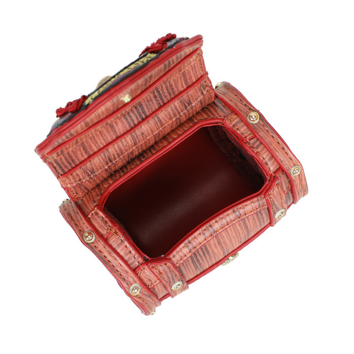 Red textured handbag with gold accents on a white background