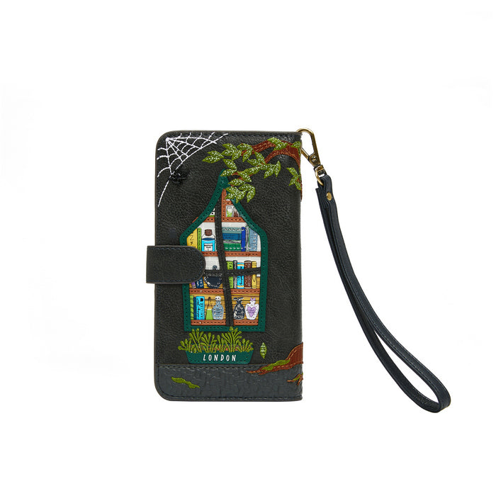 Phone wallet case with embroidered design of a house and spider web on a white background