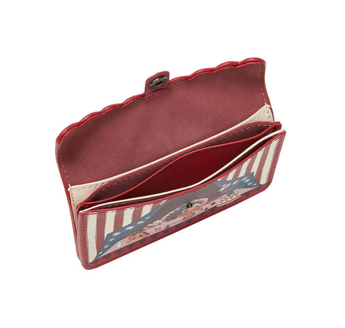 Open red wallet with American flag lining on a white background
