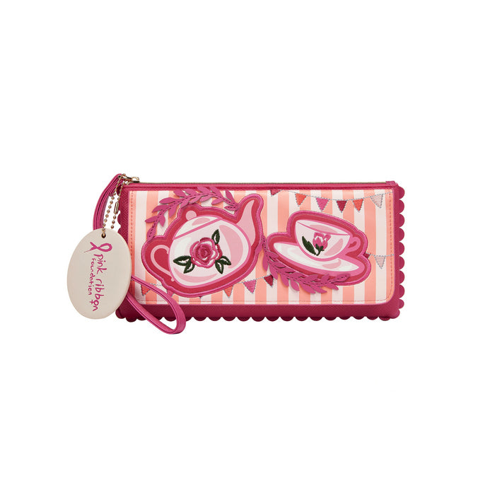 Pink wallet with tea cup design and tag on a white background
