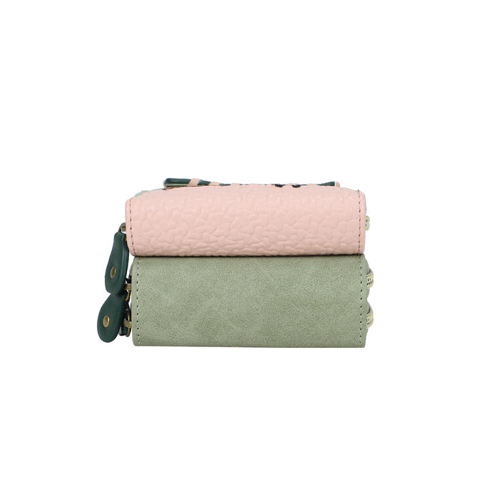 Two fabric bags, one pink and one green, stacked on a white background.