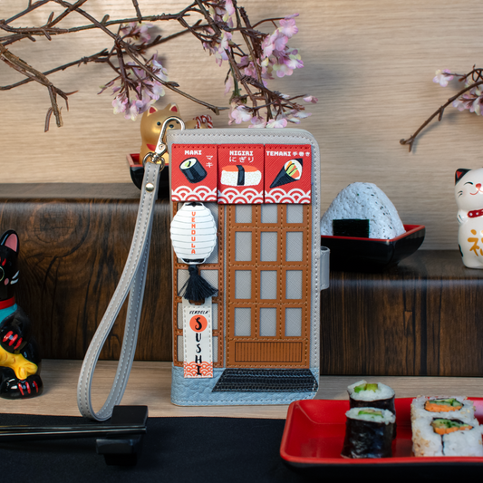 Phone case with sushi design and cherry blossoms in the background