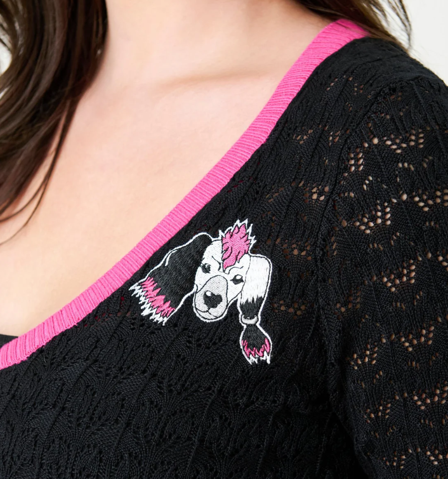 Black lace top with pink trim featuring an embroidered dog design on a plain background