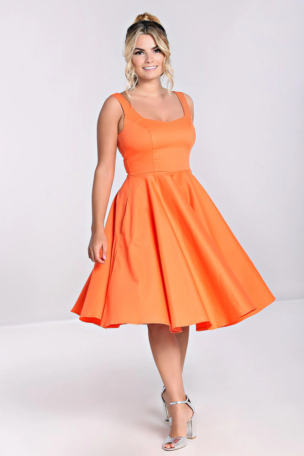 Woman wearing an orange dress on a white background