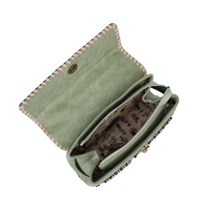 Green clutch bag with patterned interior on a white background