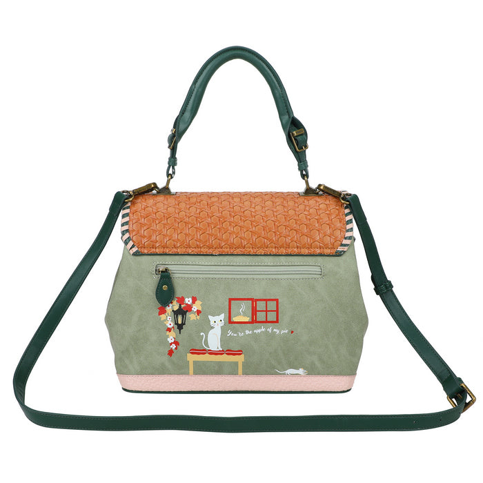 Handbag with green strap and embroidered design on a white background