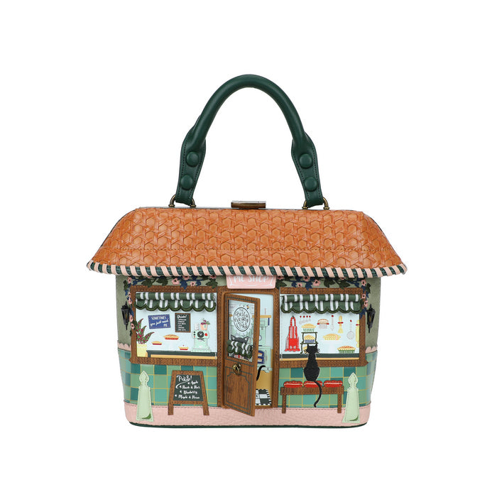 Handbag designed like a miniature house with a shop scene on a white background