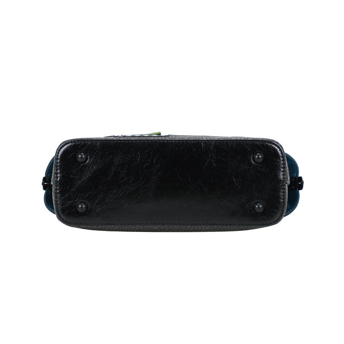 Black leather handbag with decorative elements on a white background