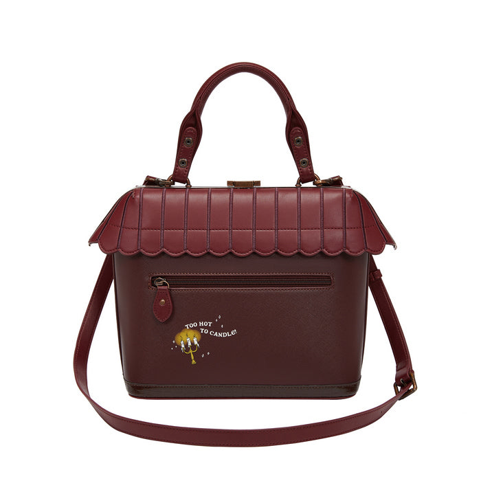 Brown handbag with scalloped edge design on a white background