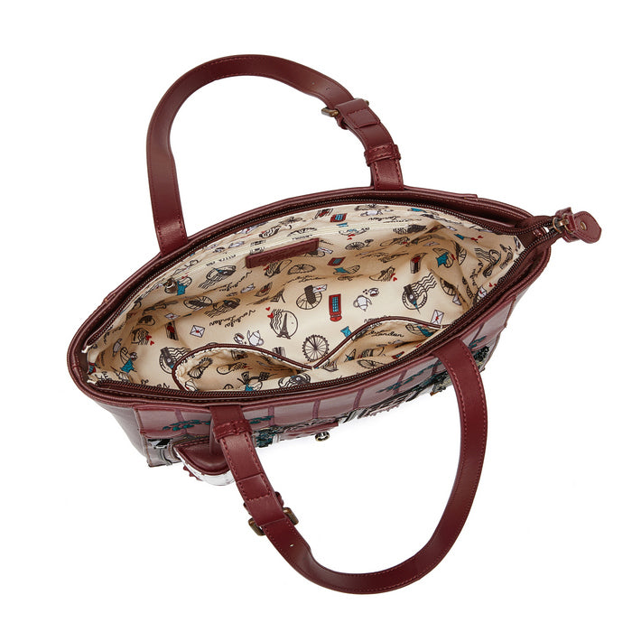 Brown handbag with patterned interior on a white background