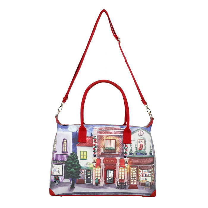 Handbag with a cityscape design and red handles on a white background