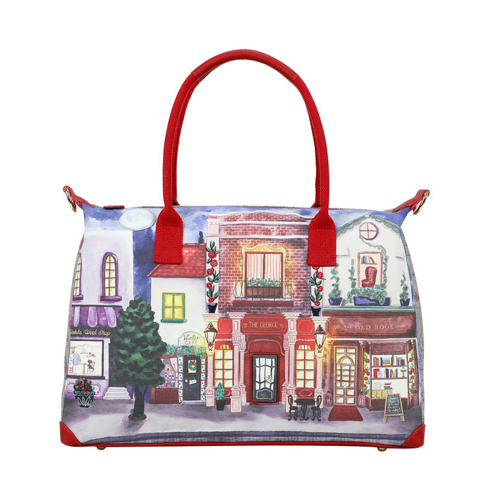Handbag with a colorful street scene design on a white background