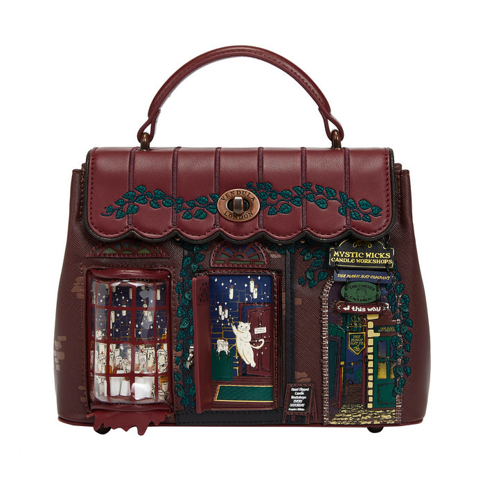 Decorative handbag with a detailed design on a white background