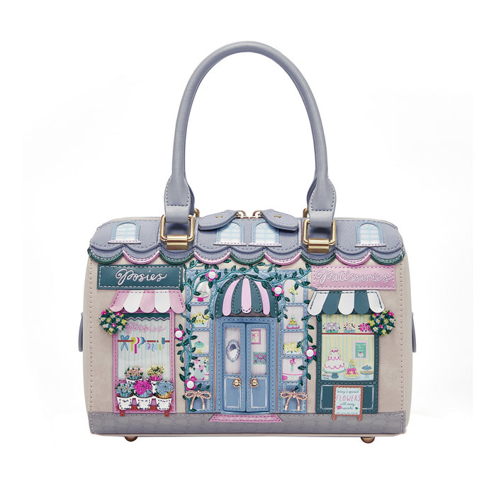 Handbag with a design of a quaint street scene on a white background