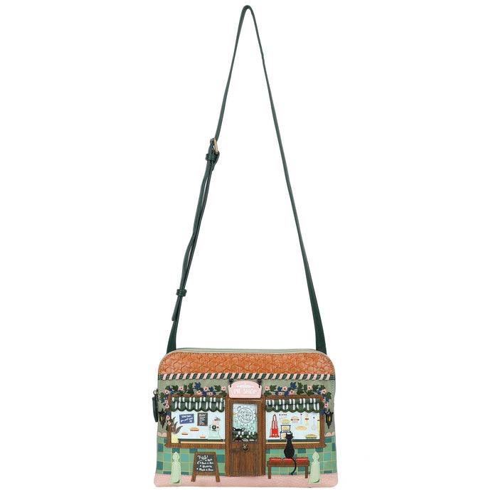 Crossbody bag with a design of a street scene on a white background