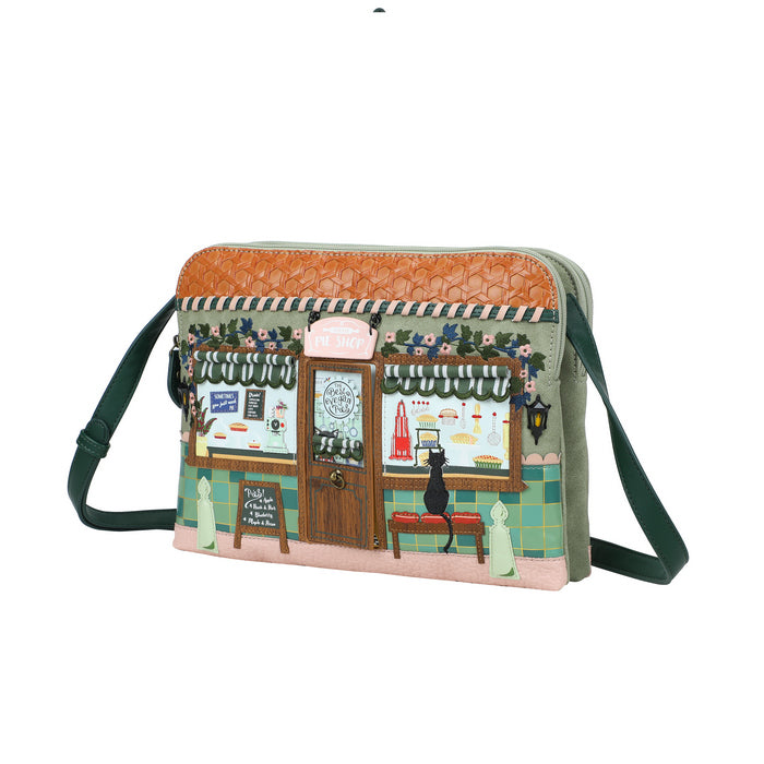 Handbag with a printed design of a cafe scene on a white background