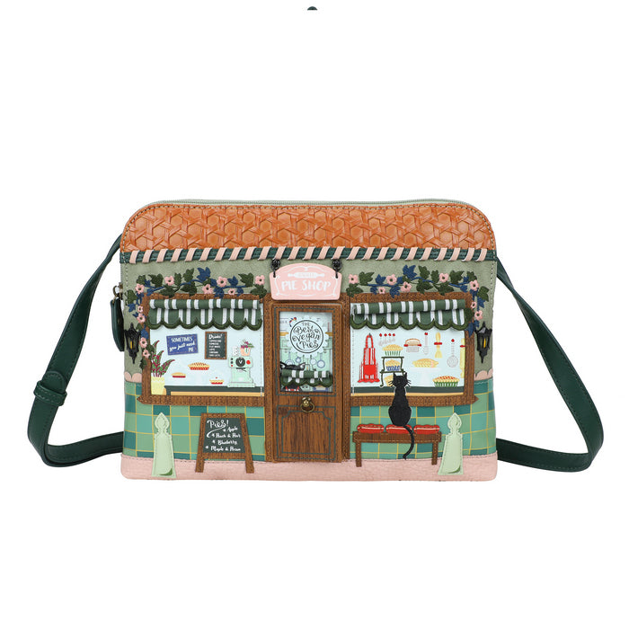 Crossbody bag with a design of a quaint store front on a white background