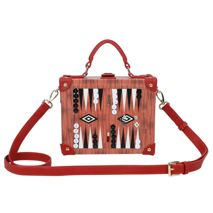Red handbag with backgammon piece design on a white background