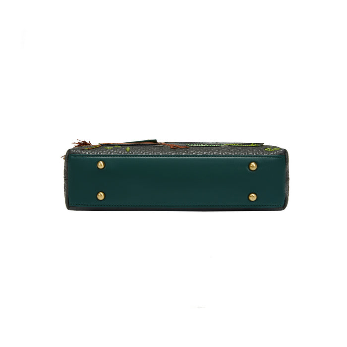 Green leather wallet with gold studs on a white background