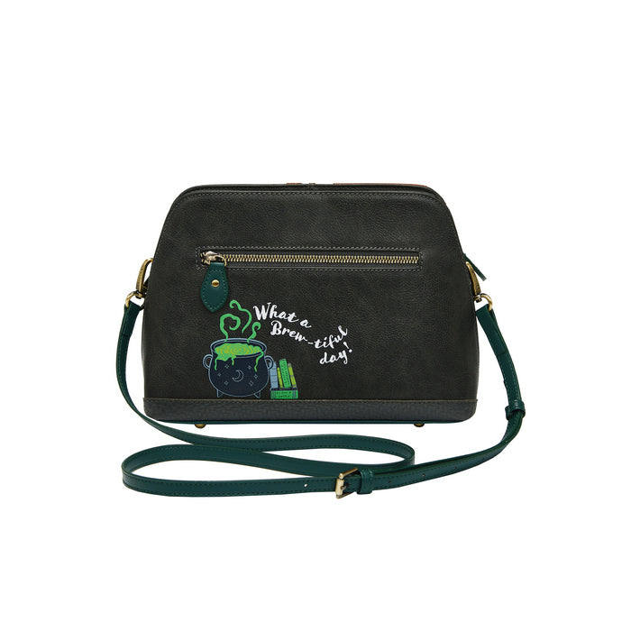 Black handbag with green strap and embroidered design on a white background