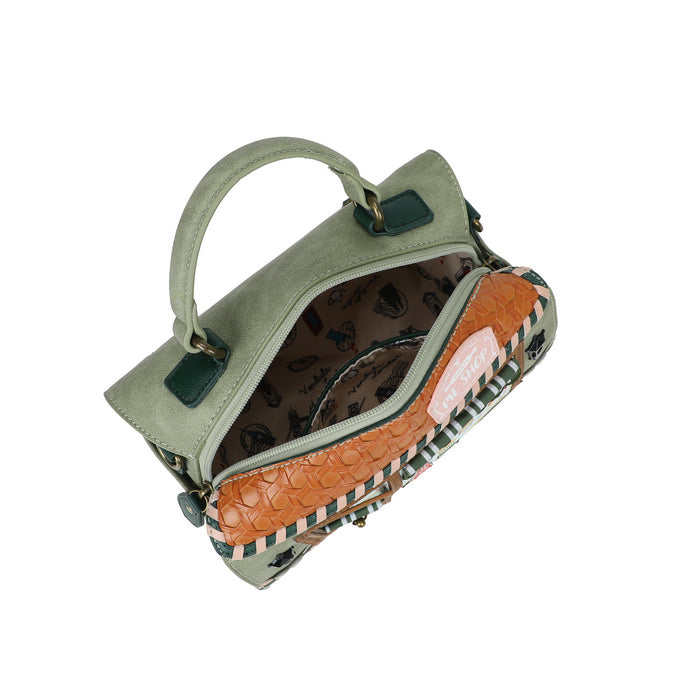 Green handbag with a patterned interior on a white background