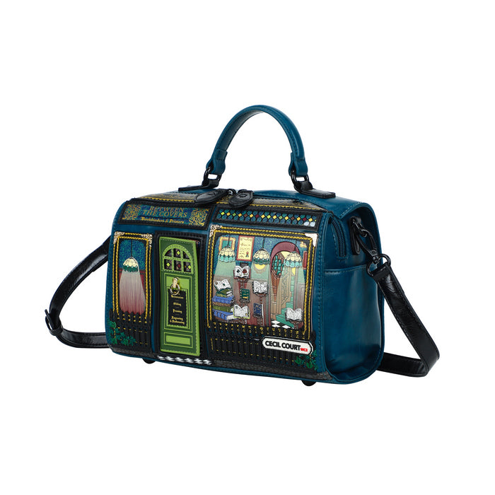Blue handbag with artistic designs on a white background