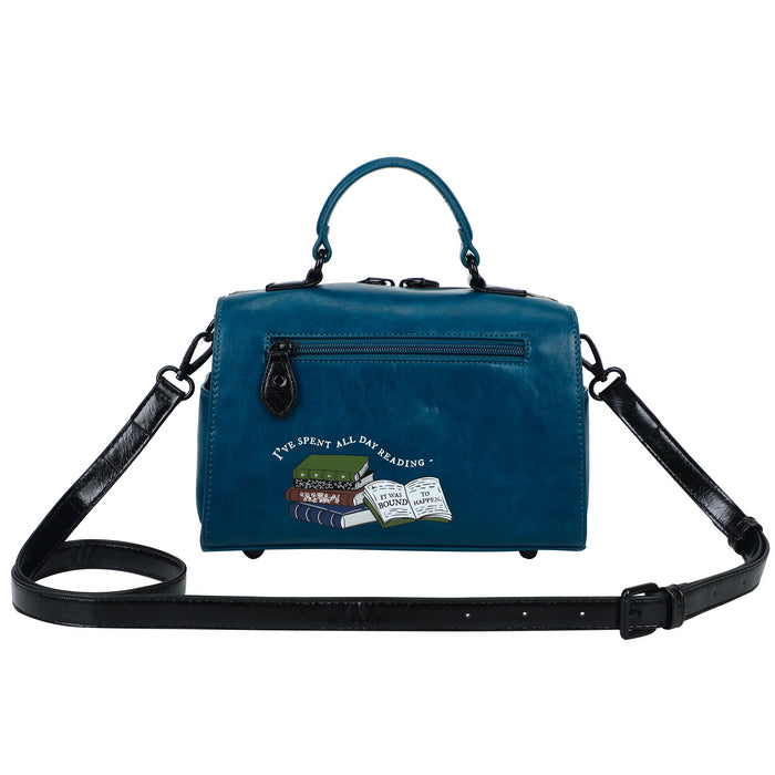 Blue handbag with a black strap on a white background