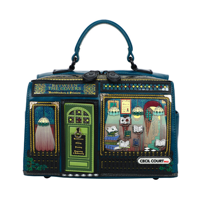 Decorative handbag with artistic design and text on a white background