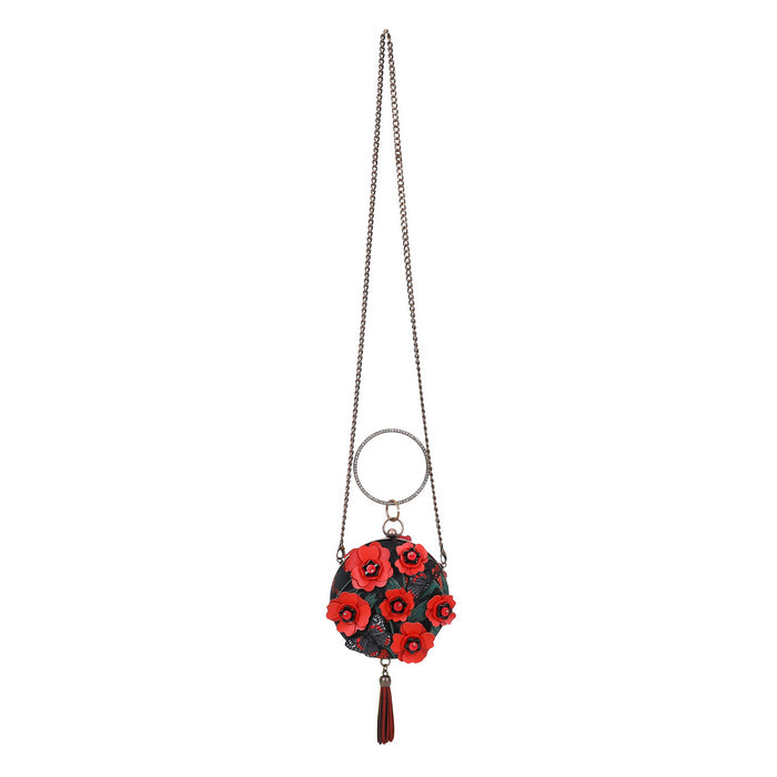 Decorative keychain with red flowers and a chain on a white background