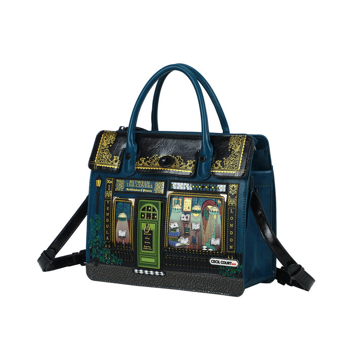 Blue handbag with decorative panels on a white background