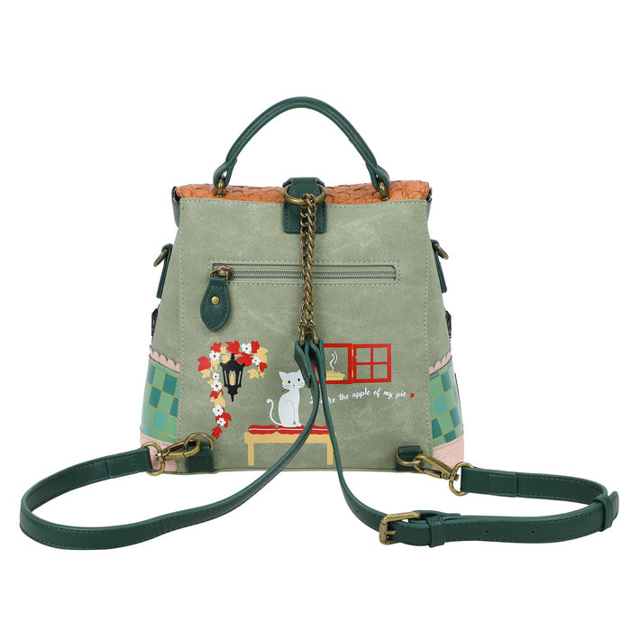 Green handbag with decorative elements on a white background