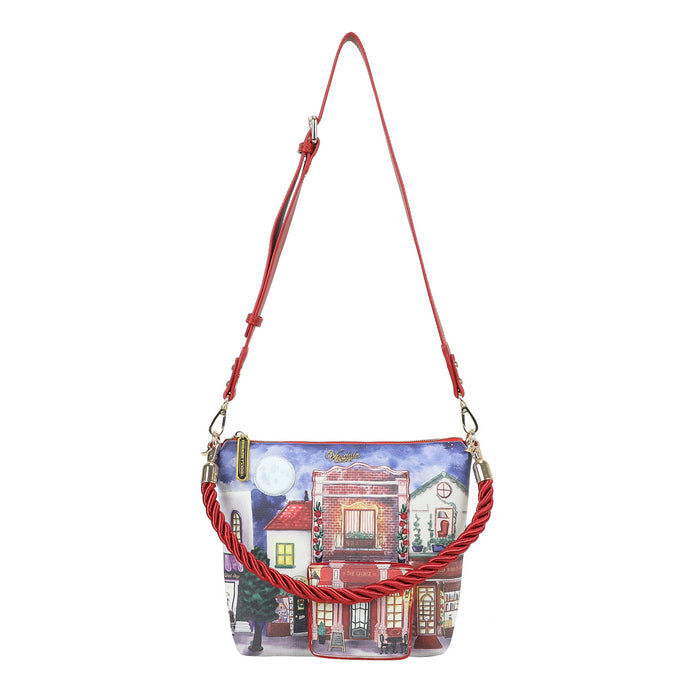 Handbag with a street scene design and red strap on a white background