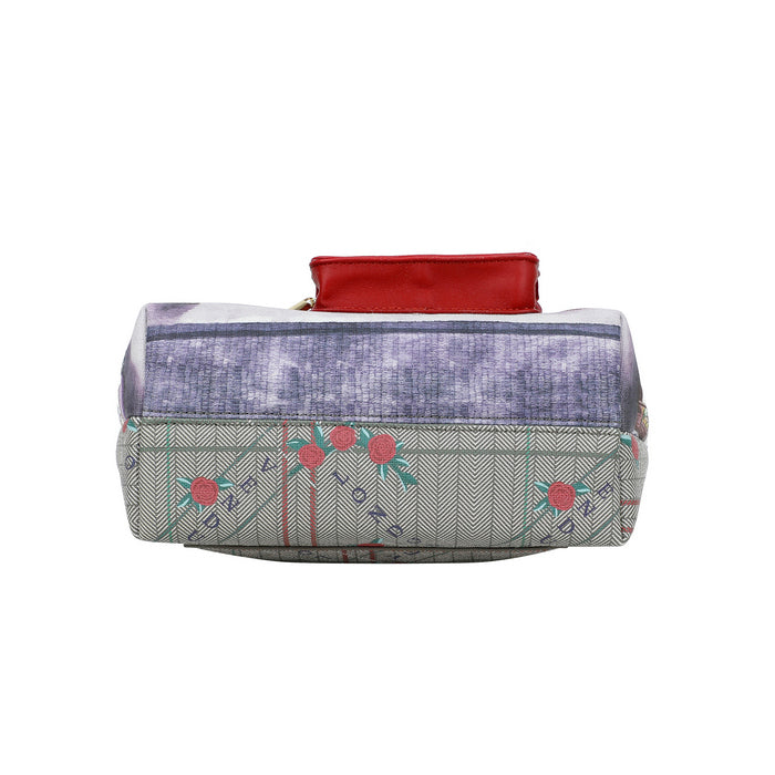 Fabric pouch with floral design and red top on a white background