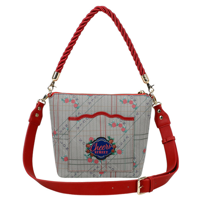 Handbag with red handle and strap on a white background