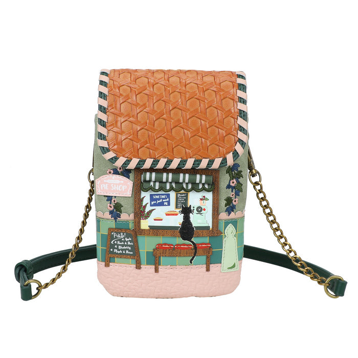 Small bag with a vintage-style design featuring a scene of a dog in a window.