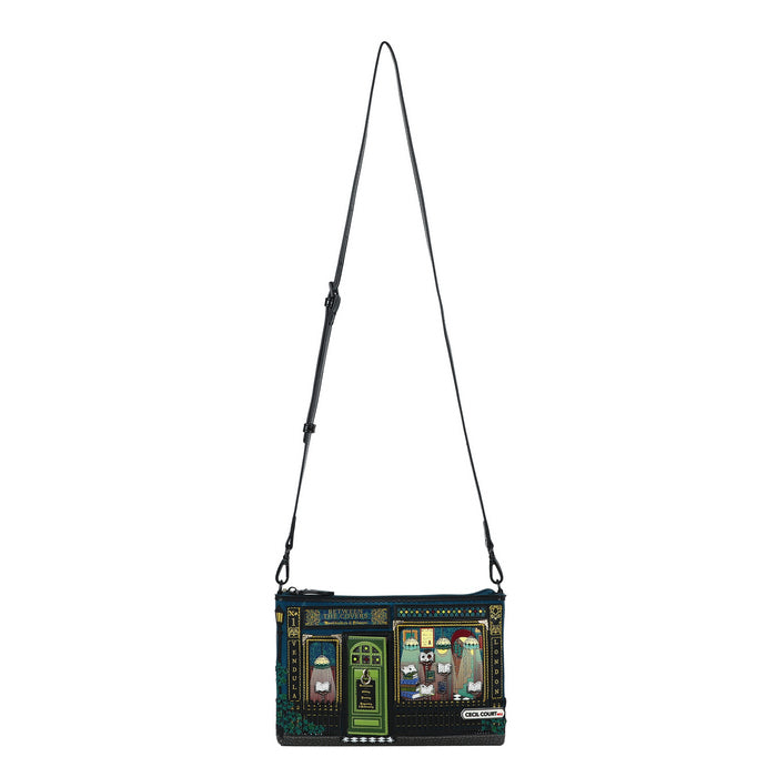 Crossbody bag with a decorative design on a white background