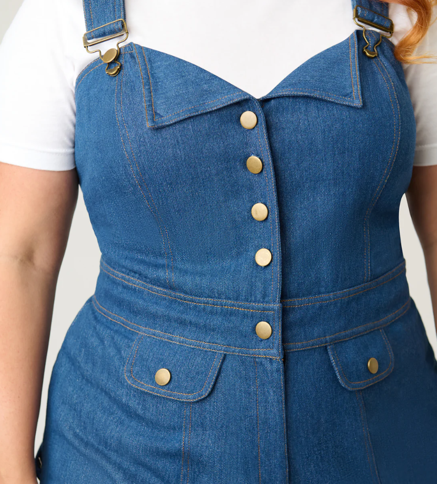 Blue denim dress with gold buttons on a white background