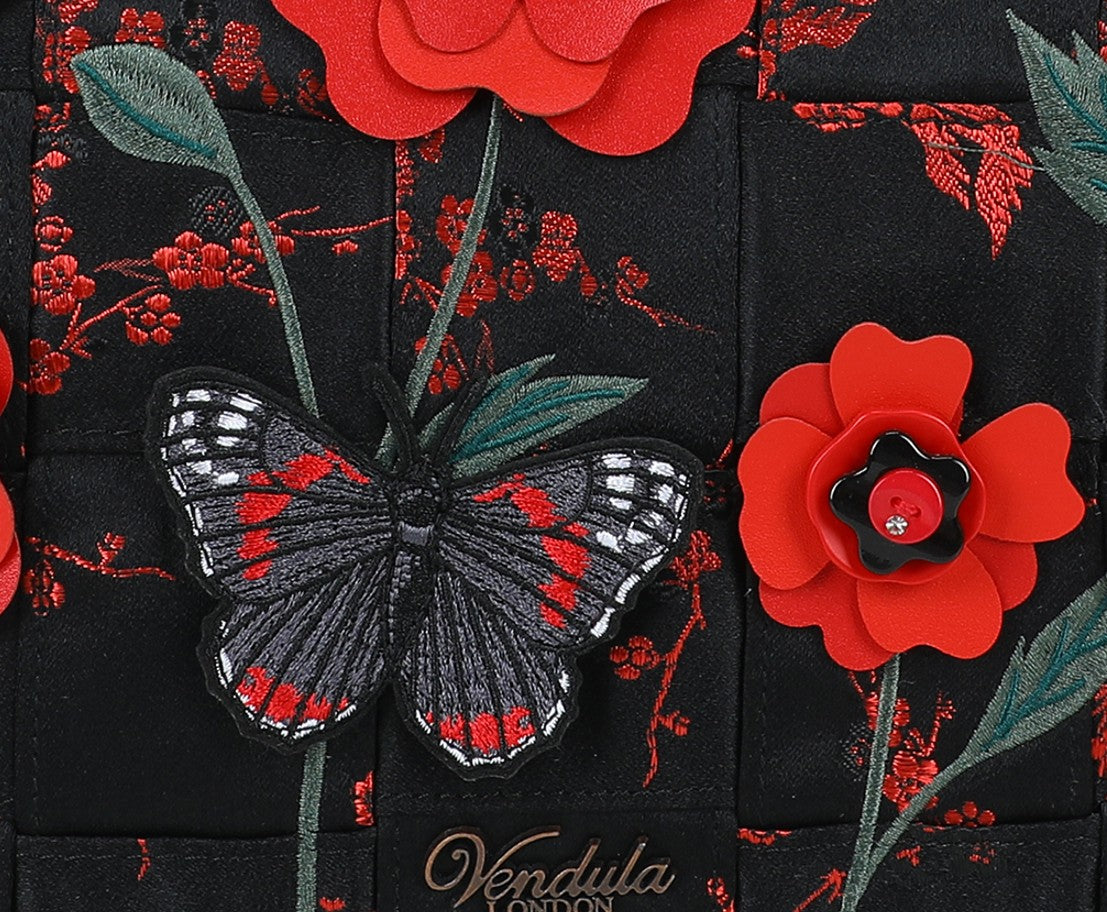 Black fabric with red floral and butterfly designs, featuring the brand 'Vendula London'.