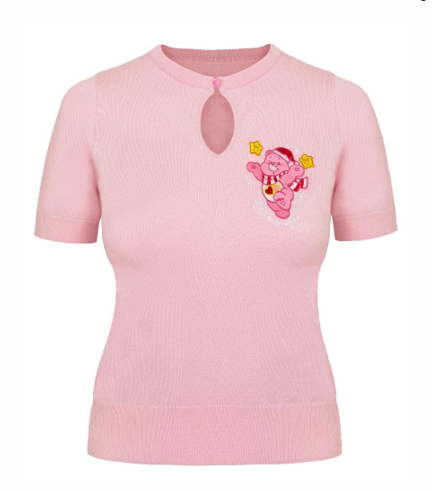 A light pink short-sleeve knit top with a keyhole neckline and an embroidered snow bear motif on the left chest, shown on a white background with product text below.