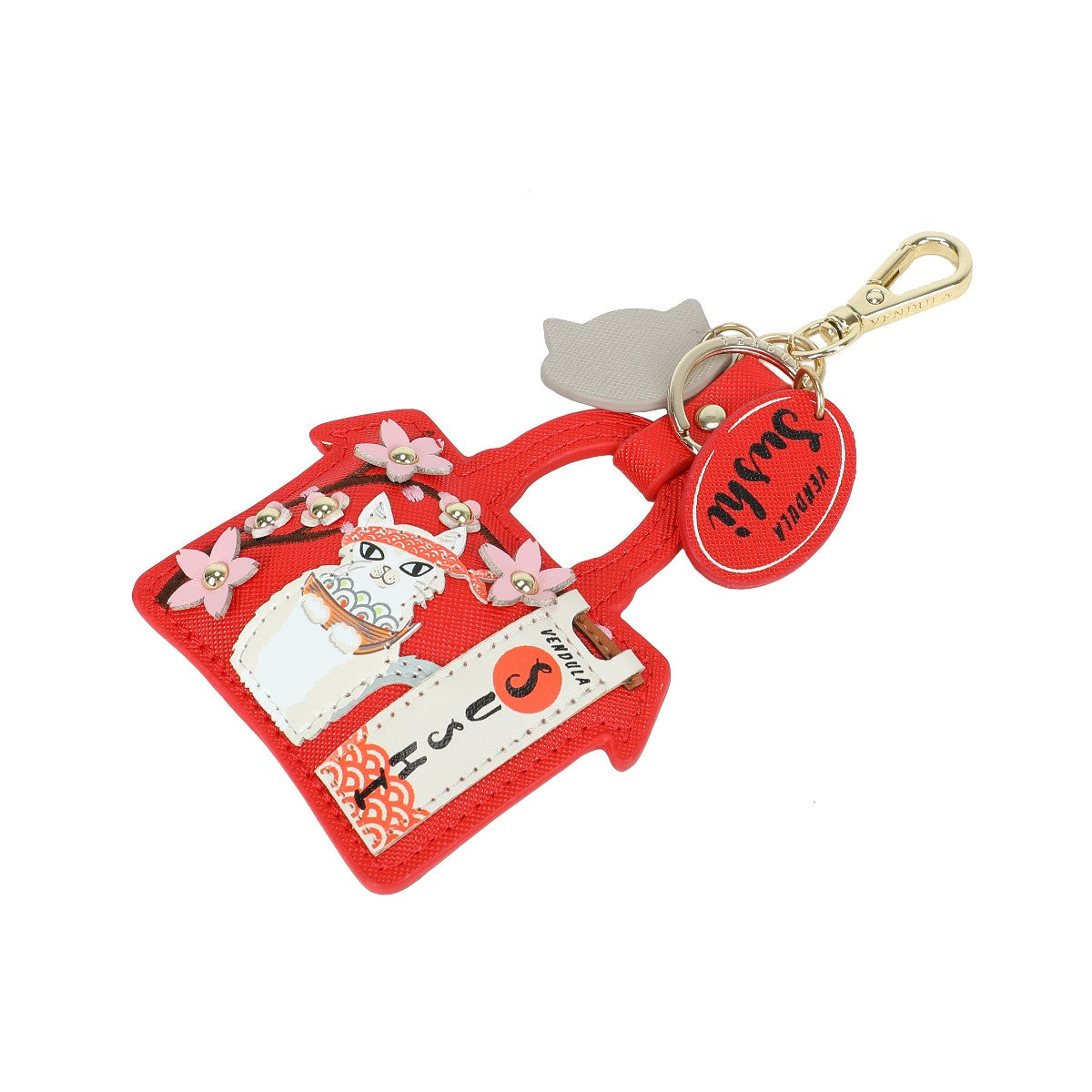 Red cat-shaped keychain with a tag on a white background