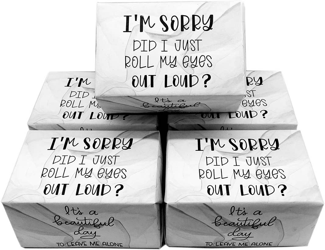 Five white marble-patterned gift boxes stacked in a pyramid arrangement, each printed with the humorous phrase 'I'M SORRY DID I JUST ROLL MY EYES OUT LOUD?' in black text.