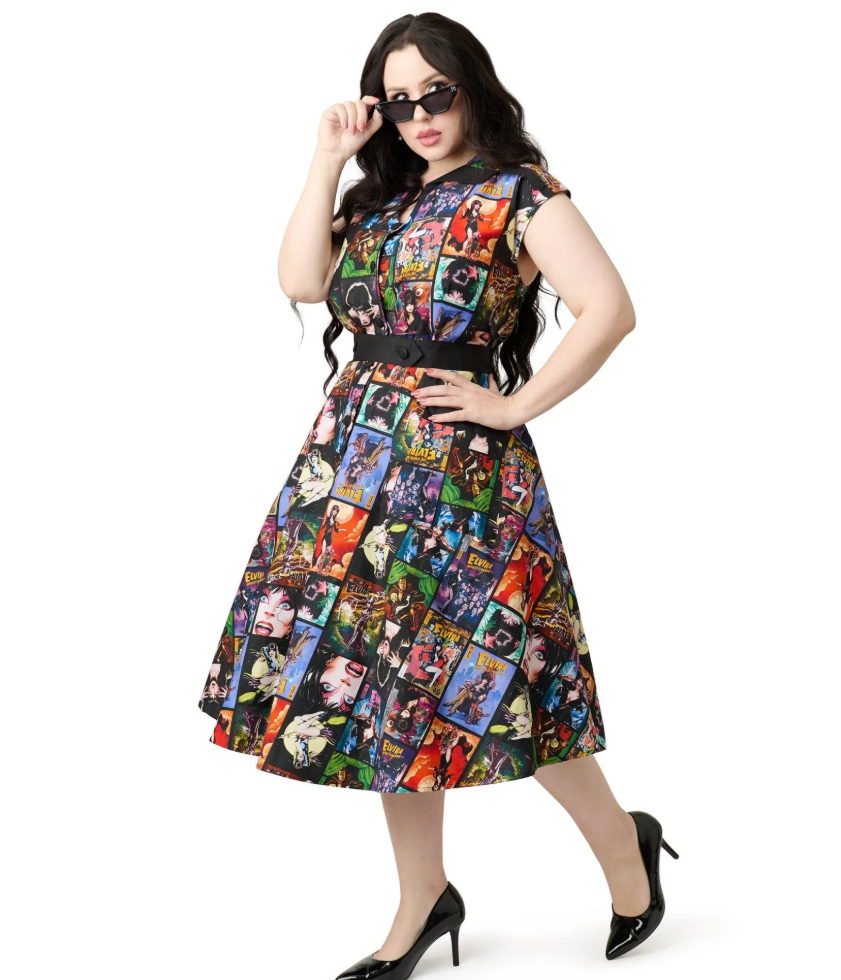 Woman wearing a colorful dress with graphic designs on a white background