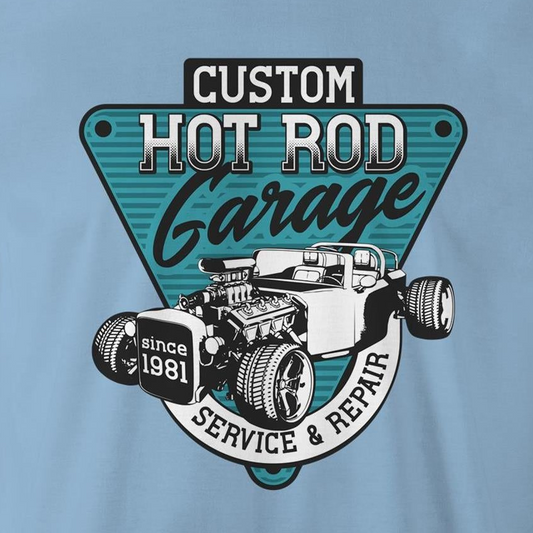 A light blue t-shirt featuring a large graphic print on the chest. The graphic is a teal and black triangular badge with the text 'CUSTOM HOT ROD Garage' and 'SERVICE & REPAIR since 1981', surrounding an illustration of a classic hot rod car with an exposed engine.