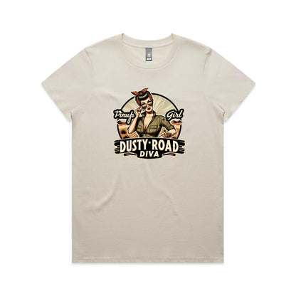 A graphic print on a white background featuring a retro-style pinup illustration of a woman with sunglasses, a red bandana, and an olive green shirt, with the text 'Pinup Girl' and 'Dusty Road Diva'.